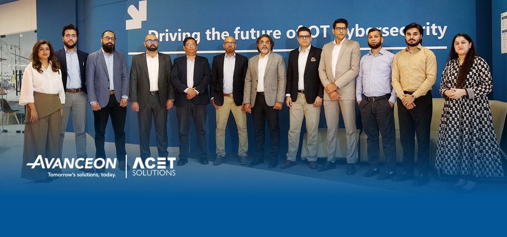 Leadership from Avanceon and ACET Solutions standing for a group picture after formally signing a partnership agreement to strengthen OT security