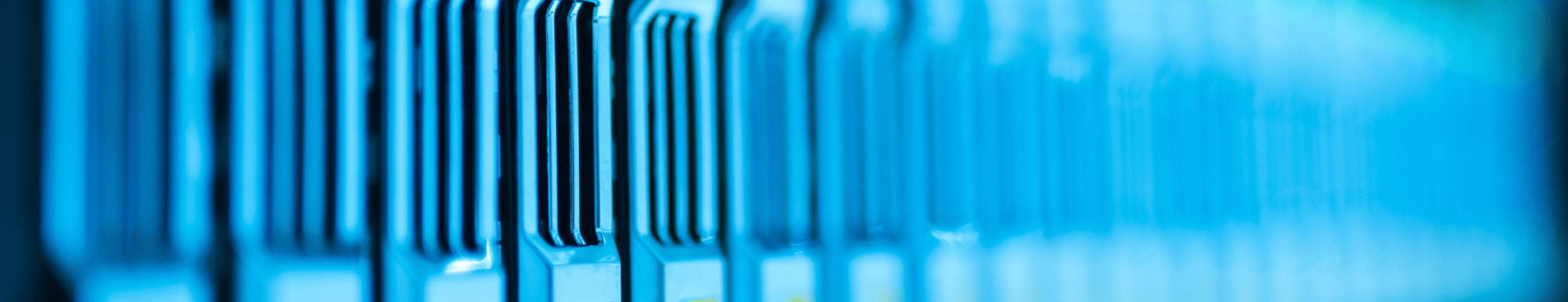 Close-up of active servers in a data center representing critical OT infrastructure requiring product lifecycle management.